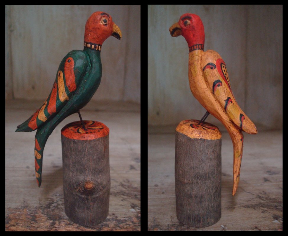 Two parrots on stumps